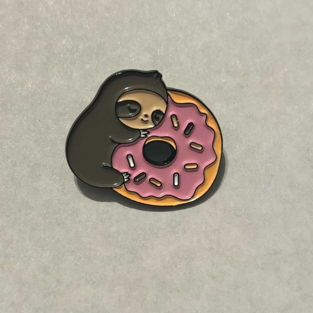 NWOT Sloth With A Donut Enamel Pin.